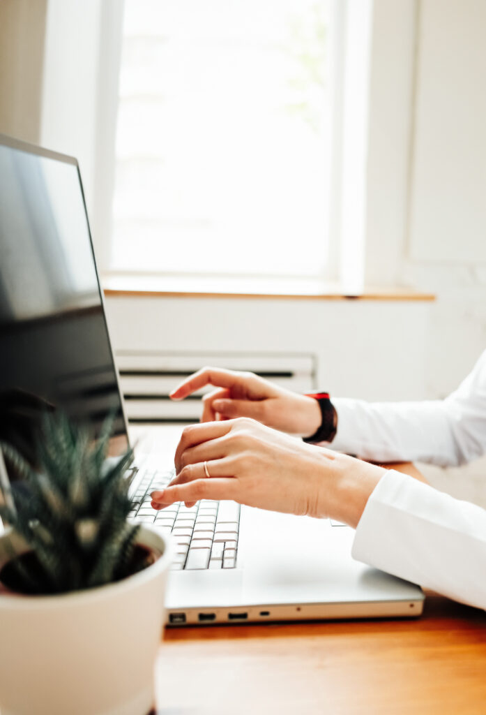 cropped hand woman with laptop v2 high